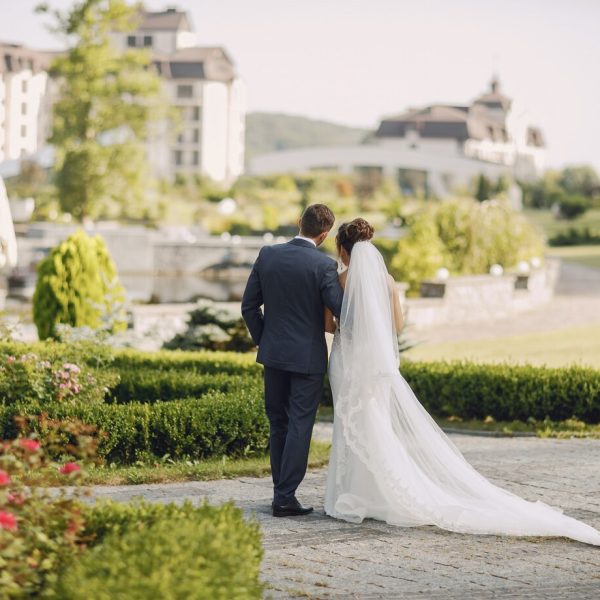 young-beautiful-bride-her-husband-standing-park-with-bouquet-flowers_1157-13680.jpg